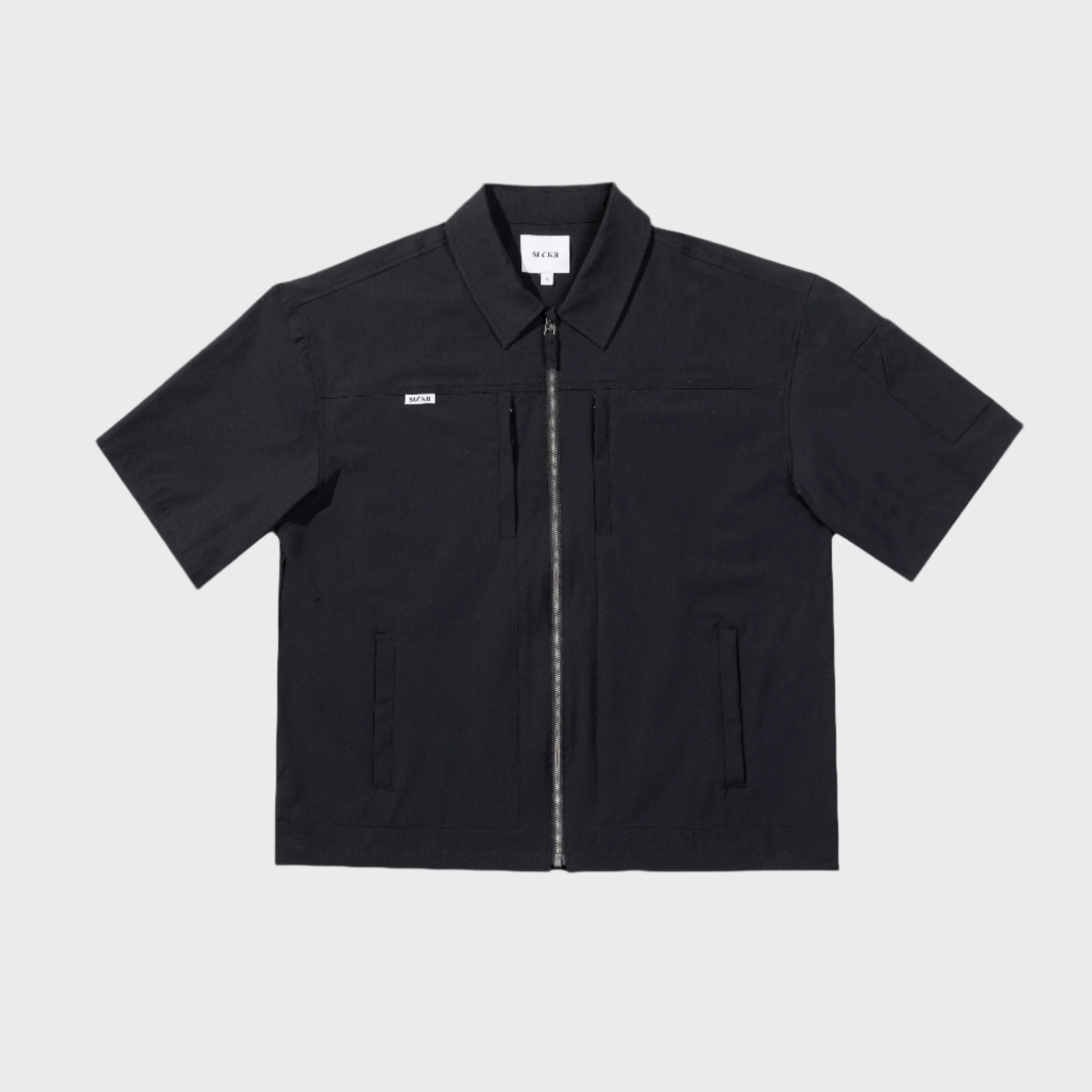 Black short-sleeve jacket on a light gray background